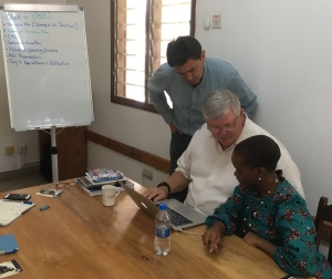 John Allen with healthcare leaders in Tanzania working on executive transition